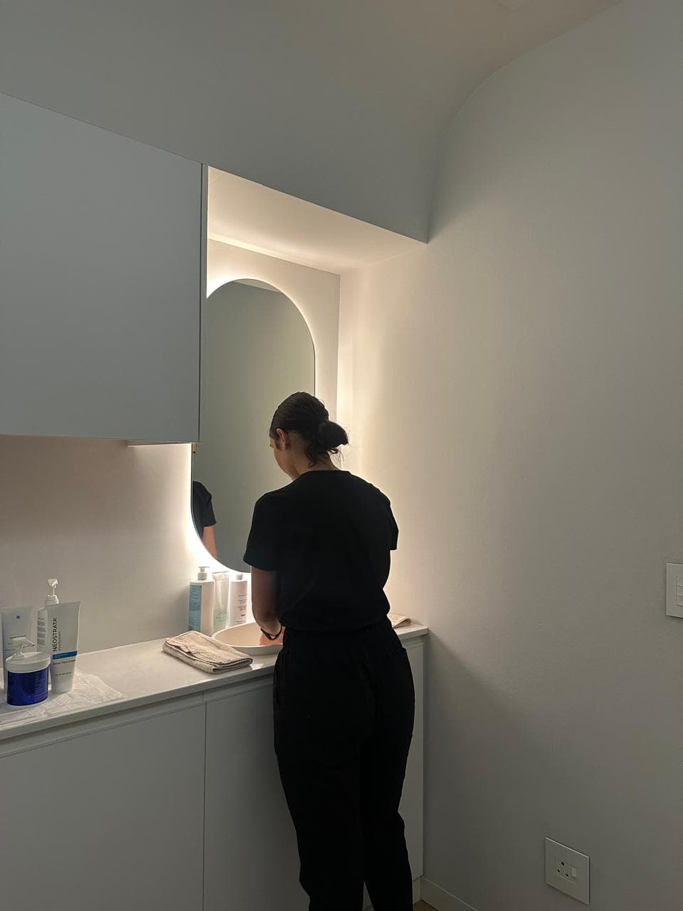 Skin & Hair Bar therapist preparing the treatment room.