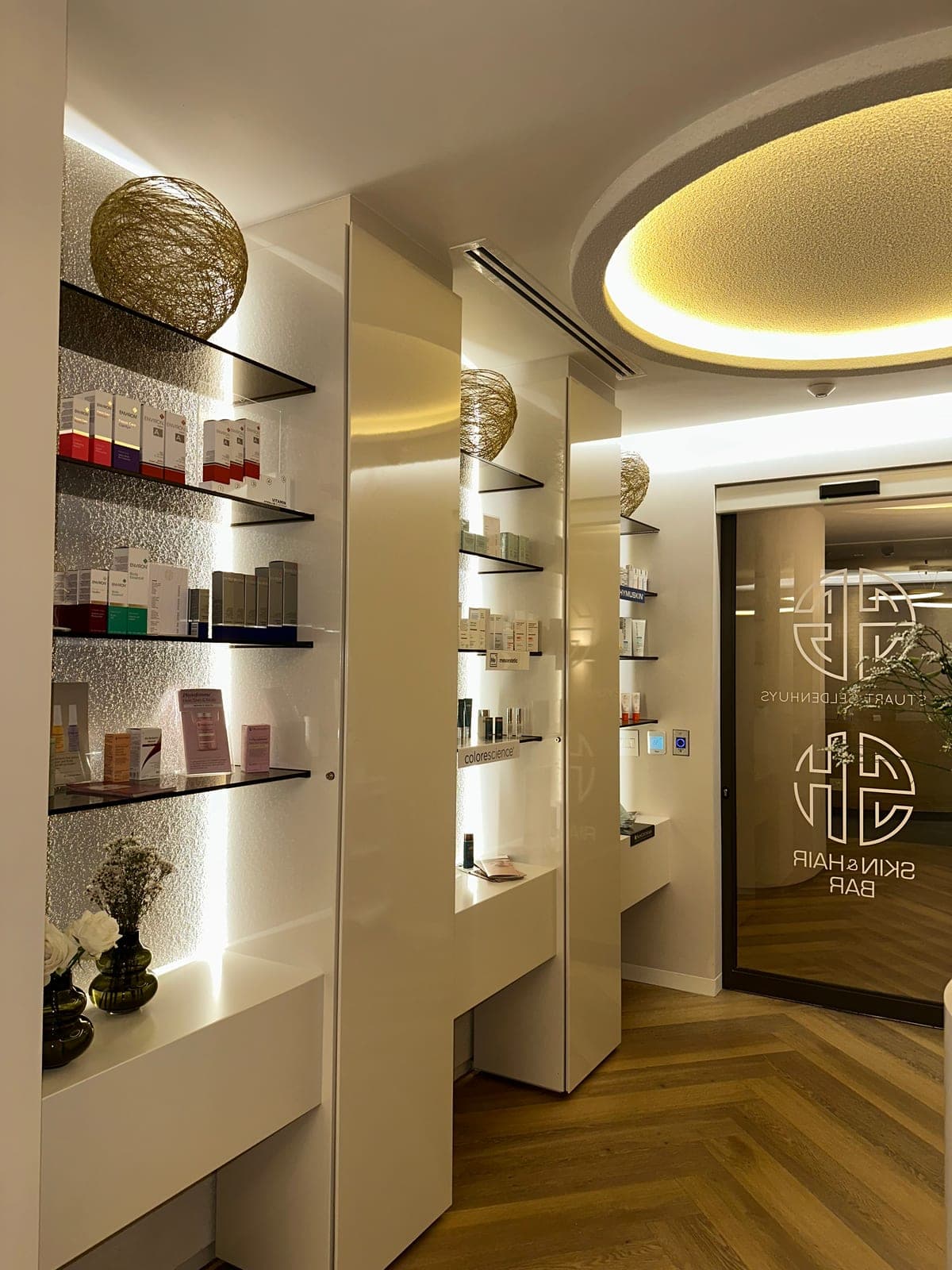 Skin & Hair Bar entrance with signature glass-door branding and illuminated product displays.